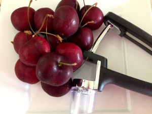 Use a cherry pitter to make the job easier, and the cherries stay whole nicer versus using a knife.